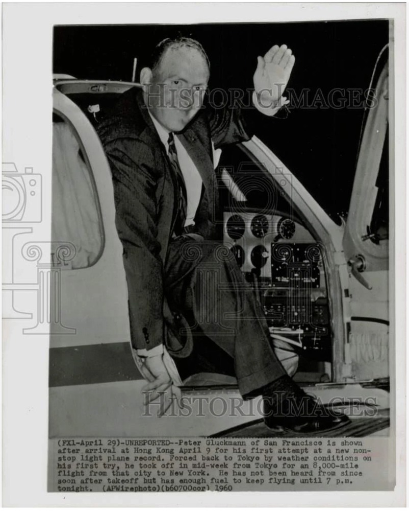 Photo Caption reads: (FXI-April 29) UNREPORTED—Peter Gluckmann of San Francisco is shown after arrival at Hong Kong April 9 for his first attempt at a new nonstop light plane record. Forced back to Tokyo by weather conditions on his first try, he took off in mid-week from Tokyo for an 8,000-mile flight from that city to New York. He has not been heard from since soon after takeoff but has enough fuel to keep flying until 7 p.m. tonight. (APWirephoto) 1960. Photographer unknown.